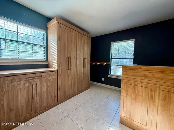 a view of a kitchen with furniture and window
