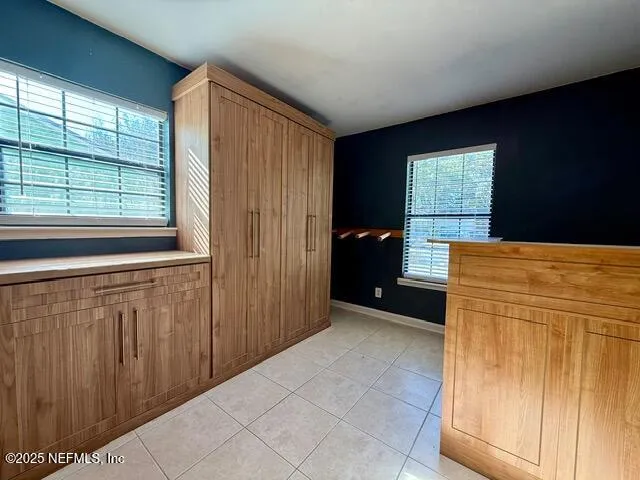 a view of a kitchen with furniture and window