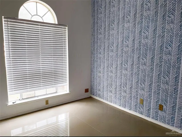 a view of empty room with a window
