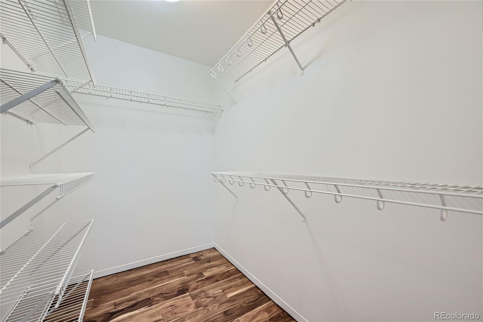 1150 Inca Street, Unit 74 Denver, CO 80204 - Photo 14 of 32 a view of a room with racks on the wall