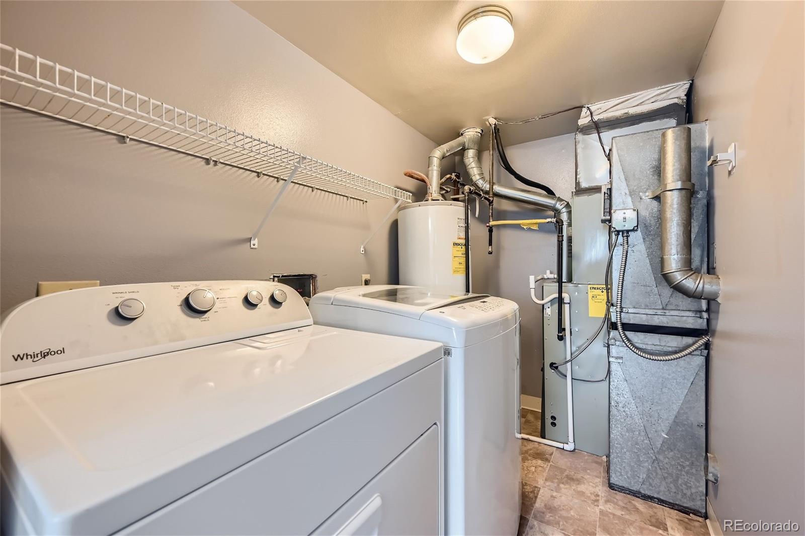 1150 Inca Street, Unit 74 Denver, CO 80204 - Photo 19 of 32 a utility room with dryer and washer