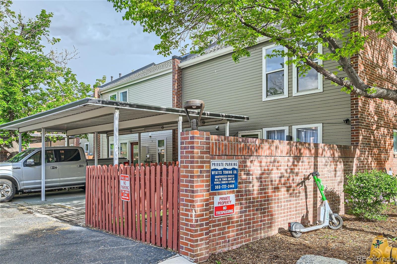 1150 Inca Street, Unit 74 Denver, CO 80204 - Photo 21 of 32 a front view of a house with parking