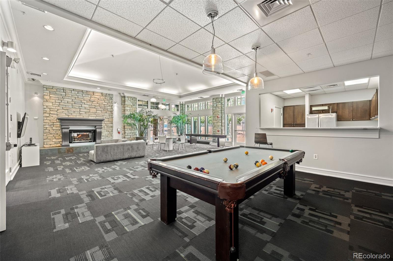 1150 Inca Street, Unit 74 Denver, CO 80204 - Photo 28 of 32 a view of a room with furniture and a fireplace