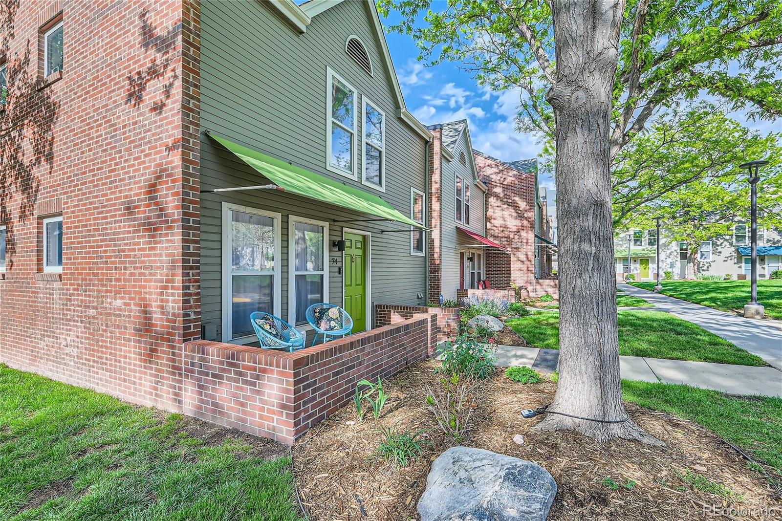 1150 Inca Street, Unit 74 Denver, CO 80204 - Photo 32 of 32 a front view of a house with garden