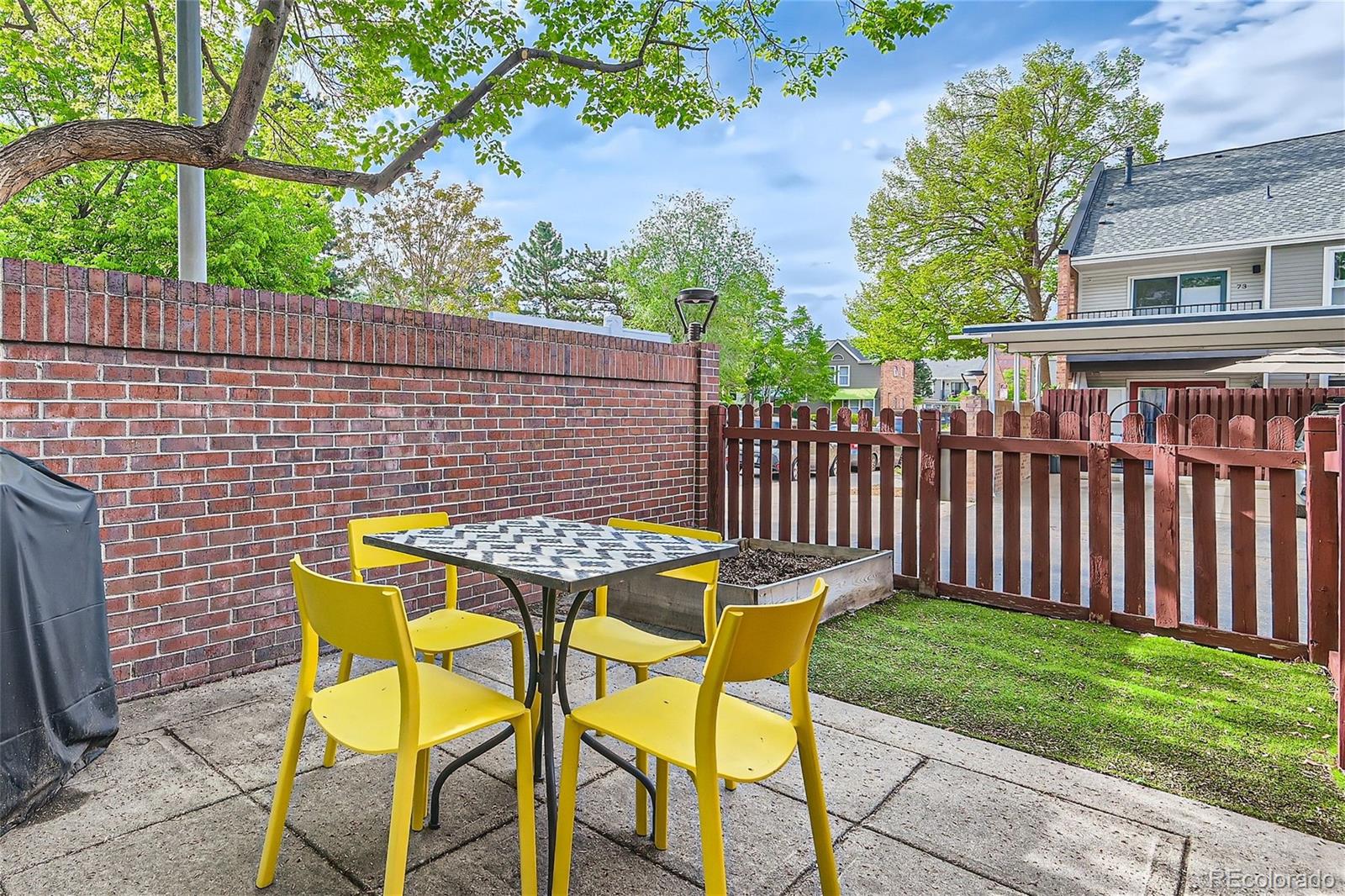 1150 Inca Street, Unit 74 Denver, CO 80204 - Photo 10 of 32 a table and chairs in the garden