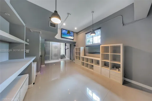 a view of an empty room with a window