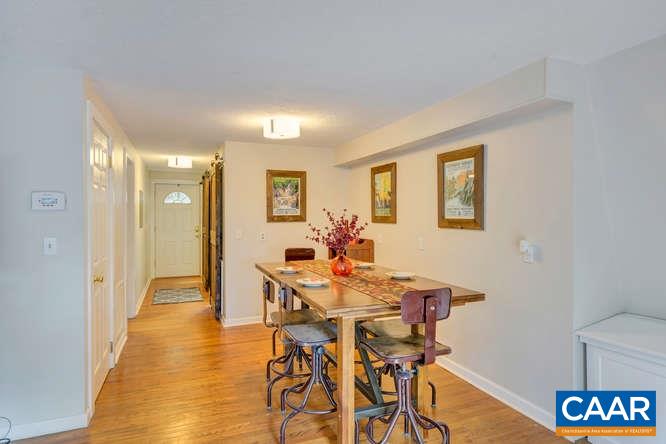 107 Goldenrod Road Ruckersville, VA 22968 - Photo 16 of 31 a view of a dining room with furniture and wooden floor