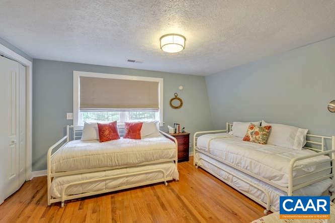 107 Goldenrod Road Ruckersville, VA 22968 - Photo 18 of 31 a bedroom with two beds and a night stand