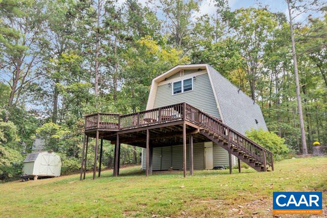 107 Goldenrod Road Ruckersville, VA 22968 - Photo 23 of 31 a backyard of a house with table and chairs
