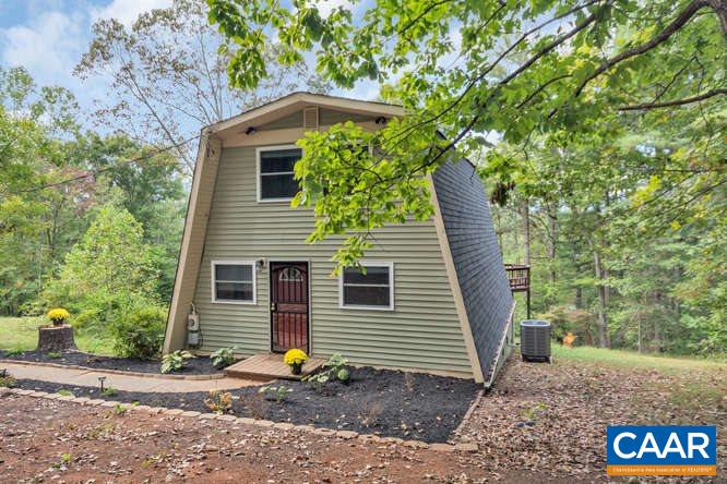 107 Goldenrod Road Ruckersville, VA 22968 - Photo 4 of 31 a front view of a house with garden