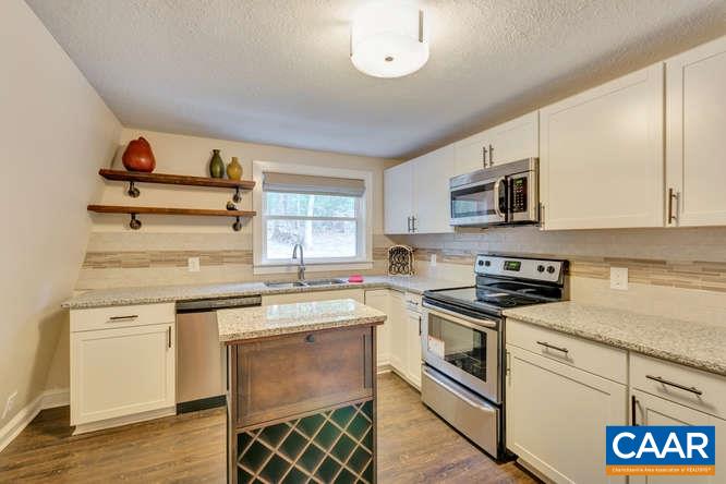 107 Goldenrod Road Ruckersville, VA 22968 - Photo 6 of 31 a kitchen with cabinets appliances and a window