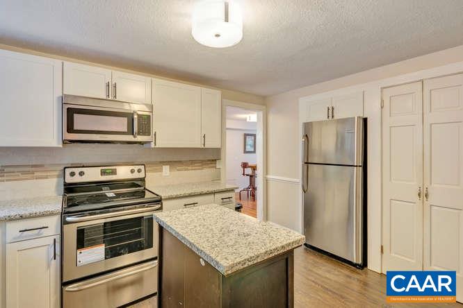 107 Goldenrod Road Ruckersville, VA 22968 - Photo 9 of 31 a kitchen with a refrigerator stove and microwave