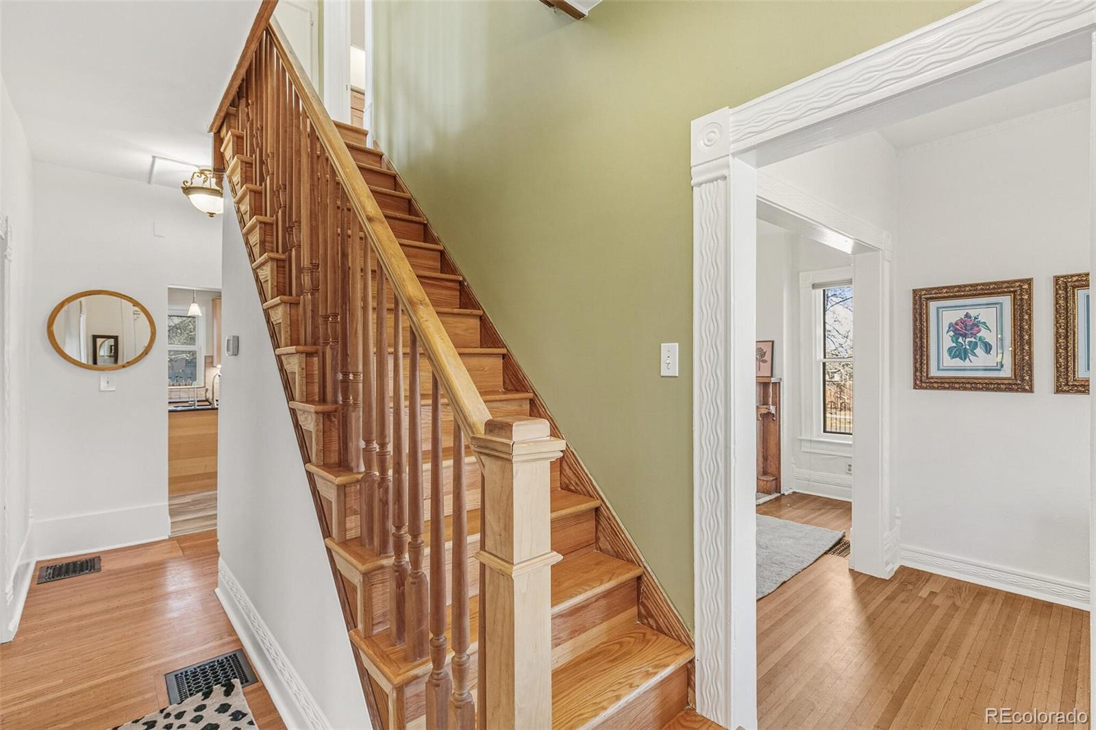 3885 Wolff Street Denver, CO 80212 - Photo 20 of 50 a view of a hallway with windows and wooden floor