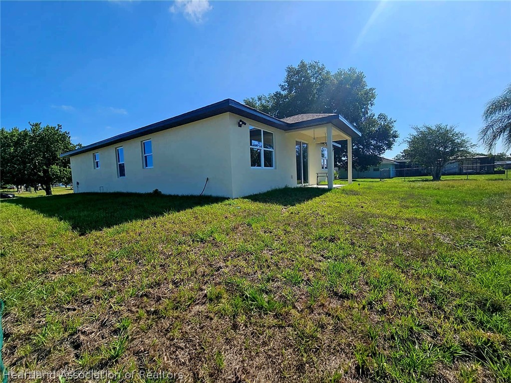 7324 Rolling Hills Road Sebring, FL 33876 - Photo 6 of 23 a house view with a garden space