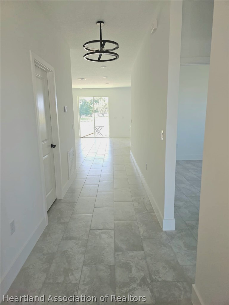 7324 Rolling Hills Road Sebring, FL 33876 - Photo 8 of 23 a hallway with a sink