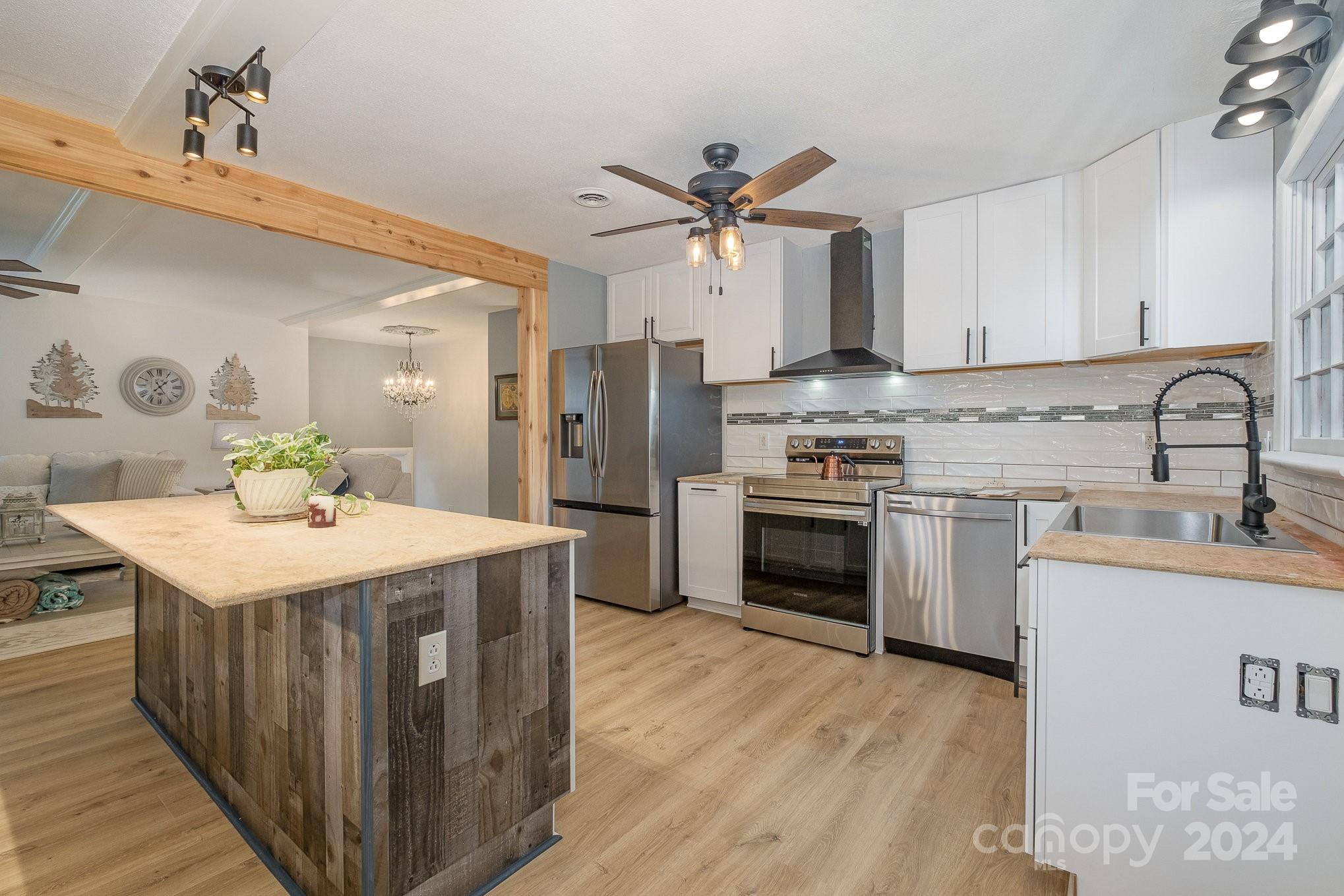 4081 Section House Road Hickory, NC 28601 - Photo 11 of 38 a kitchen with a sink a stove top oven and cabinets