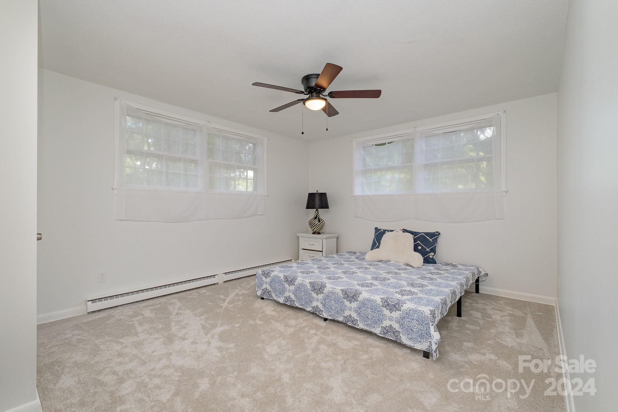 4081 Section House Road Hickory, NC 28601 - Photo 26 of 38 a living room with hard wood floor and a ceiling fan