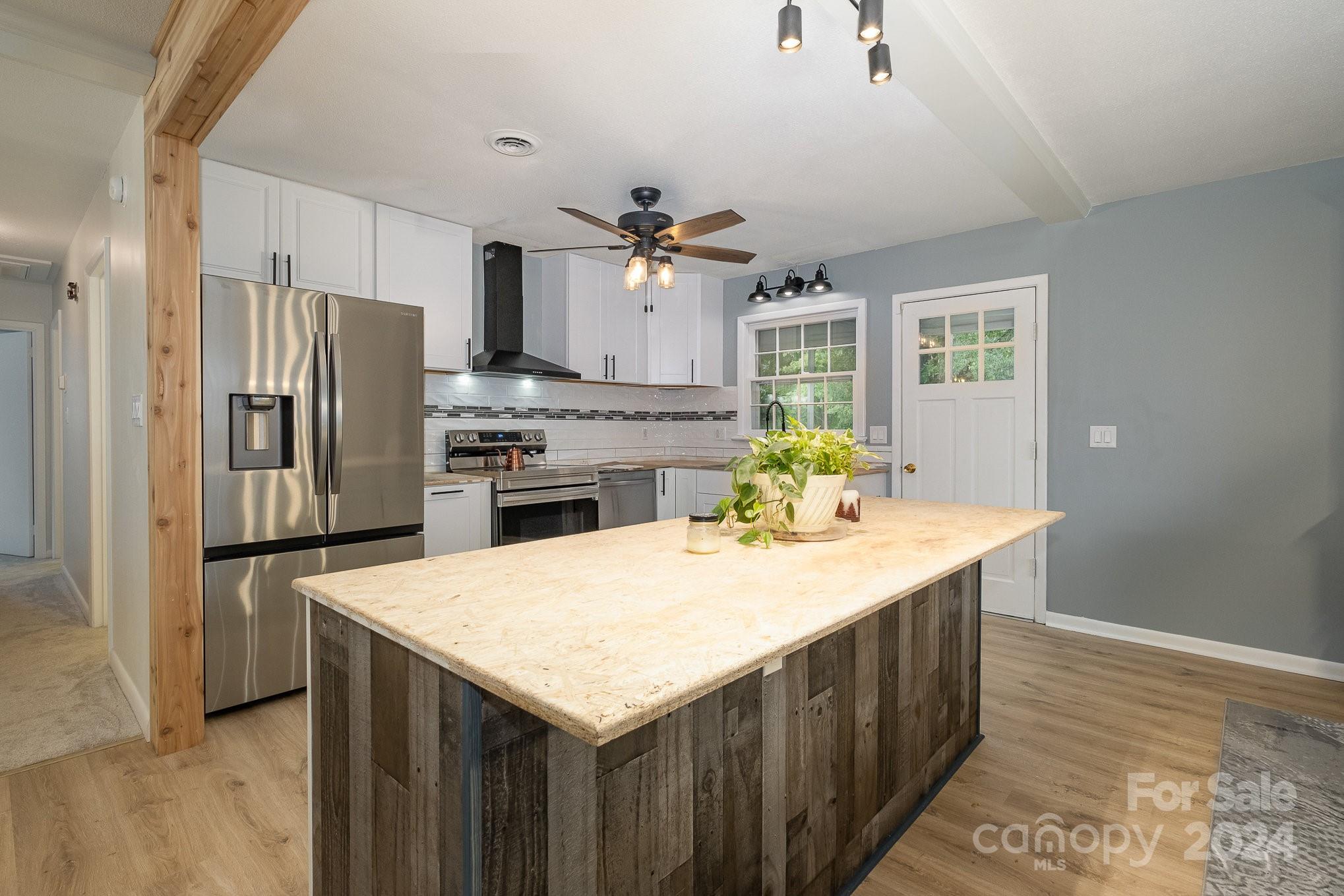 4081 Section House Road Hickory, NC 28601 - Photo 10 of 38 a kitchen with kitchen island a counter top space appliances and cabinets