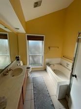 7411 Creekfield Drive Spring, TX 77379 - Photo 12 of 16 a bathroom with a sink and a tub