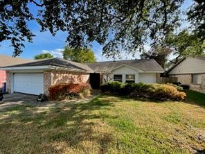 7411 Creekfield Drive Spring, TX 77379 - Photo 3 of 16 a view of a house with a yard