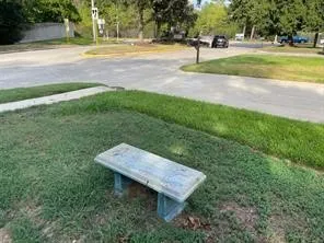 a view of a yard with brick wall
