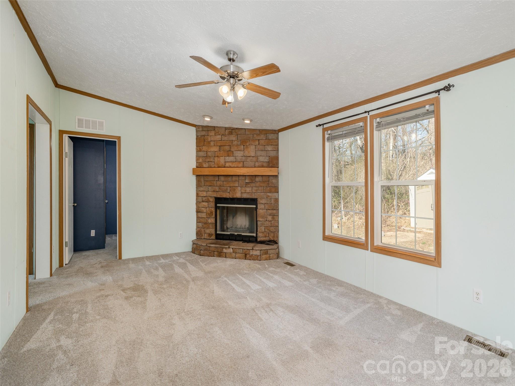 112 Lynn Estate Road Hendersonville, NC 28792 - Photo 11 of 24 an empty room with windows and fireplace