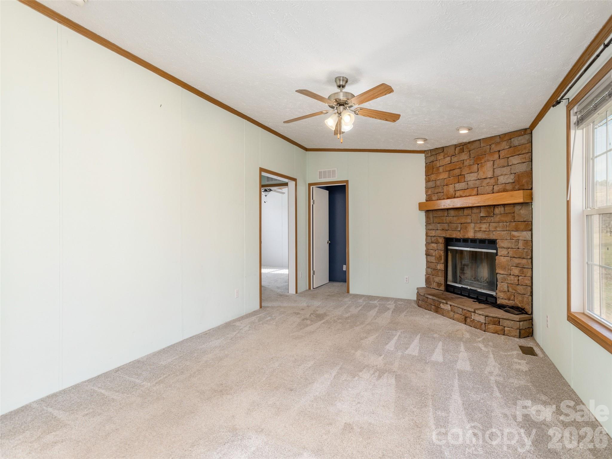 112 Lynn Estate Road Hendersonville, NC 28792 - Photo 12 of 24 a view of an empty room with a fireplace