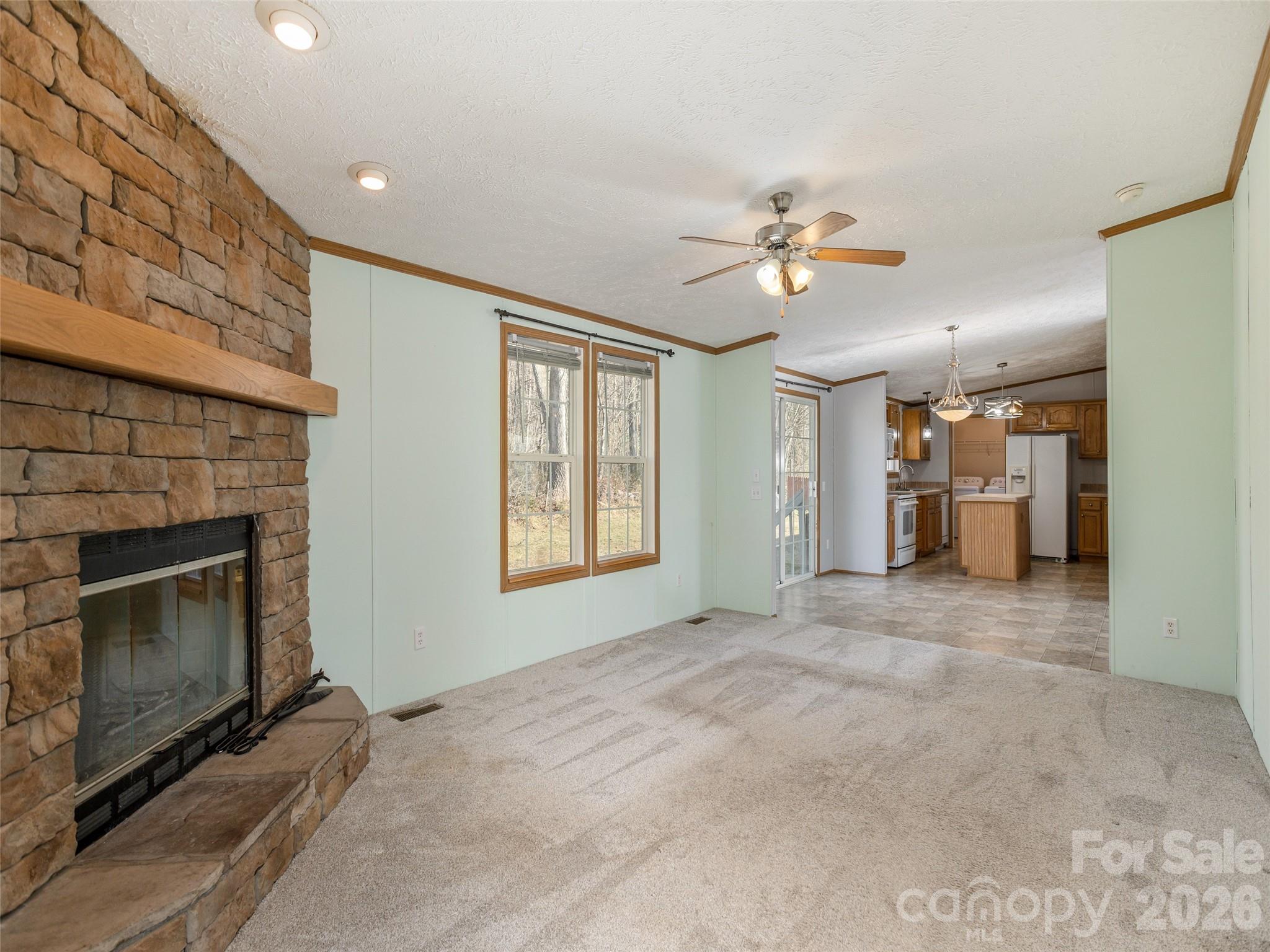 112 Lynn Estate Road Hendersonville, NC 28792 - Photo 13 of 24 a view of an empty room with a fireplace and a window