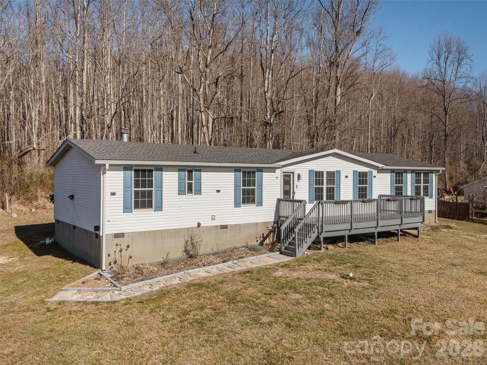 112 Lynn Estate Road Hendersonville, NC 28792 - Photo 2 of 24 a front view of a house with a yard and garage