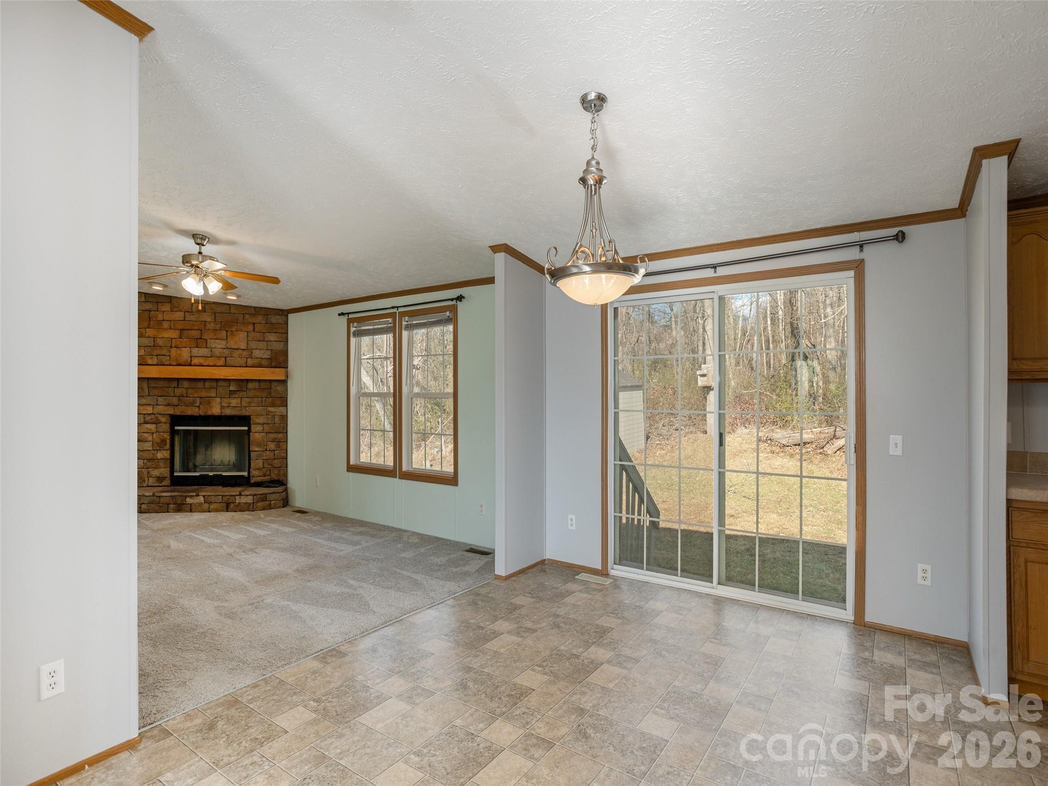 112 Lynn Estate Road Hendersonville, NC 28792 - Photo 10 of 24 a view of an empty room with window cabinet and fire place