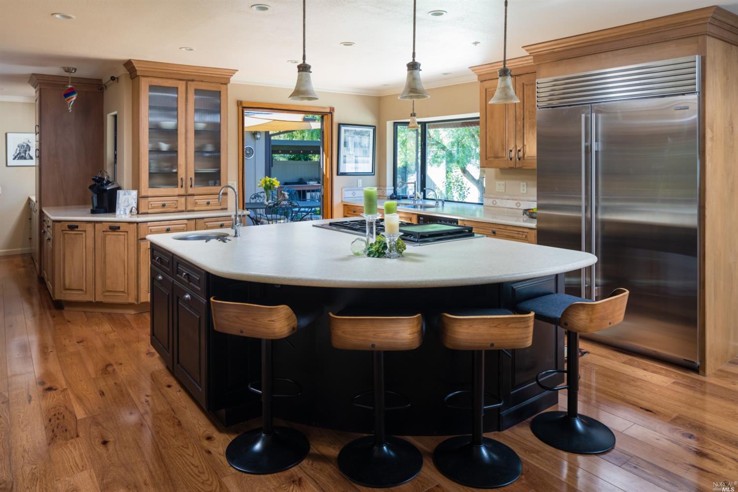 508 East Napa Street Sonoma, CA 95476 - Photo 1 of 1 a kitchen with stainless steel appliances granite countertop a stove a sink and a refrigerator