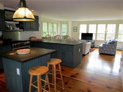 19 Higgins Hollow Road Truro, MA 02666 - Photo 14 of 34 a kitchen with stainless steel appliances granite countertop a sink a stove and a wooden floors
