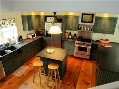 19 Higgins Hollow Road Truro, MA 02666 - Photo 15 of 34 a kitchen with a sink stove and refrigerator