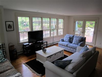 19 Higgins Hollow Road Truro, MA 02666 - Photo 17 of 34 a living room with furniture and a flat screen tv