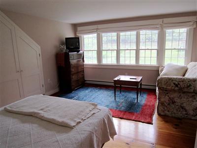 19 Higgins Hollow Road Truro, MA 02666 - Photo 19 of 34 a living room with furniture and a window