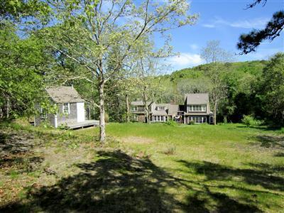 19 Higgins Hollow Road Truro, MA 02666 - Photo 23 of 34 a view of a house with a yard