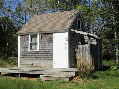 19 Higgins Hollow Road Truro, MA 02666 - Photo 24 of 34 a view of house with backyard and garden