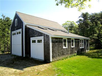 19 Higgins Hollow Road Truro, MA 02666 - Photo 27 of 34 a view of a house with a yard
