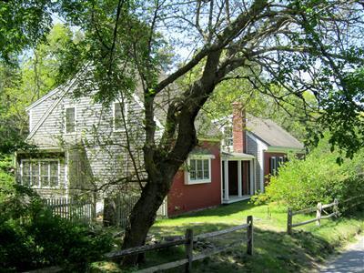 19 Higgins Hollow Road Truro, MA 02666 - Photo 3 of 34 a view of house in front of a big yard with large trees