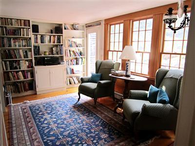 19 Higgins Hollow Road Truro, MA 02666 - Photo 6 of 34 a living room with furniture and a book shelf