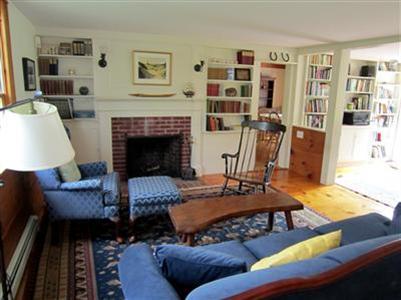 19 Higgins Hollow Road Truro, MA 02666 - Photo 7 of 34 a living room with furniture and a fireplace