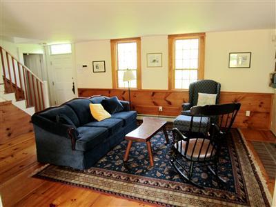 19 Higgins Hollow Road Truro, MA 02666 - Photo 9 of 34 a living room with furniture and a window