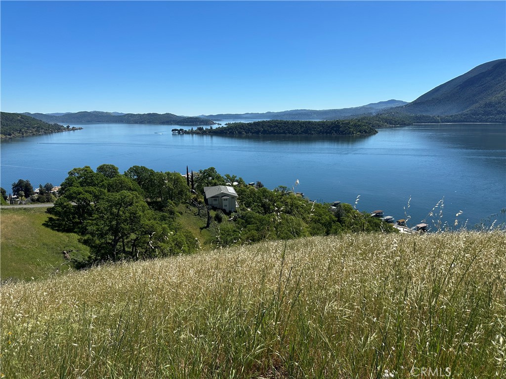 7620 Verna Way Lucerne, CA 95458 - Photo 3 of 5 a view of a lake with a mountain in the background