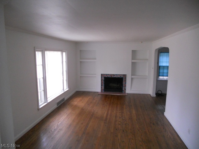 3946 Bushnell Road University Heights, OH 44118 - Photo 2 of 12 Spacious Living Room with Gleaming Hardwood Floors Fireplace and Built-ins