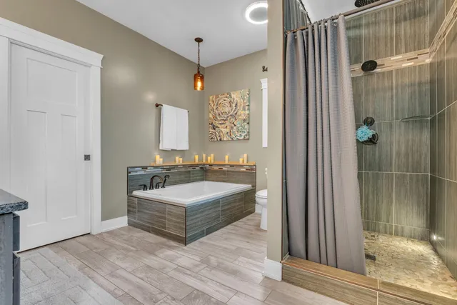 a room with lots of white furniture and a gallery