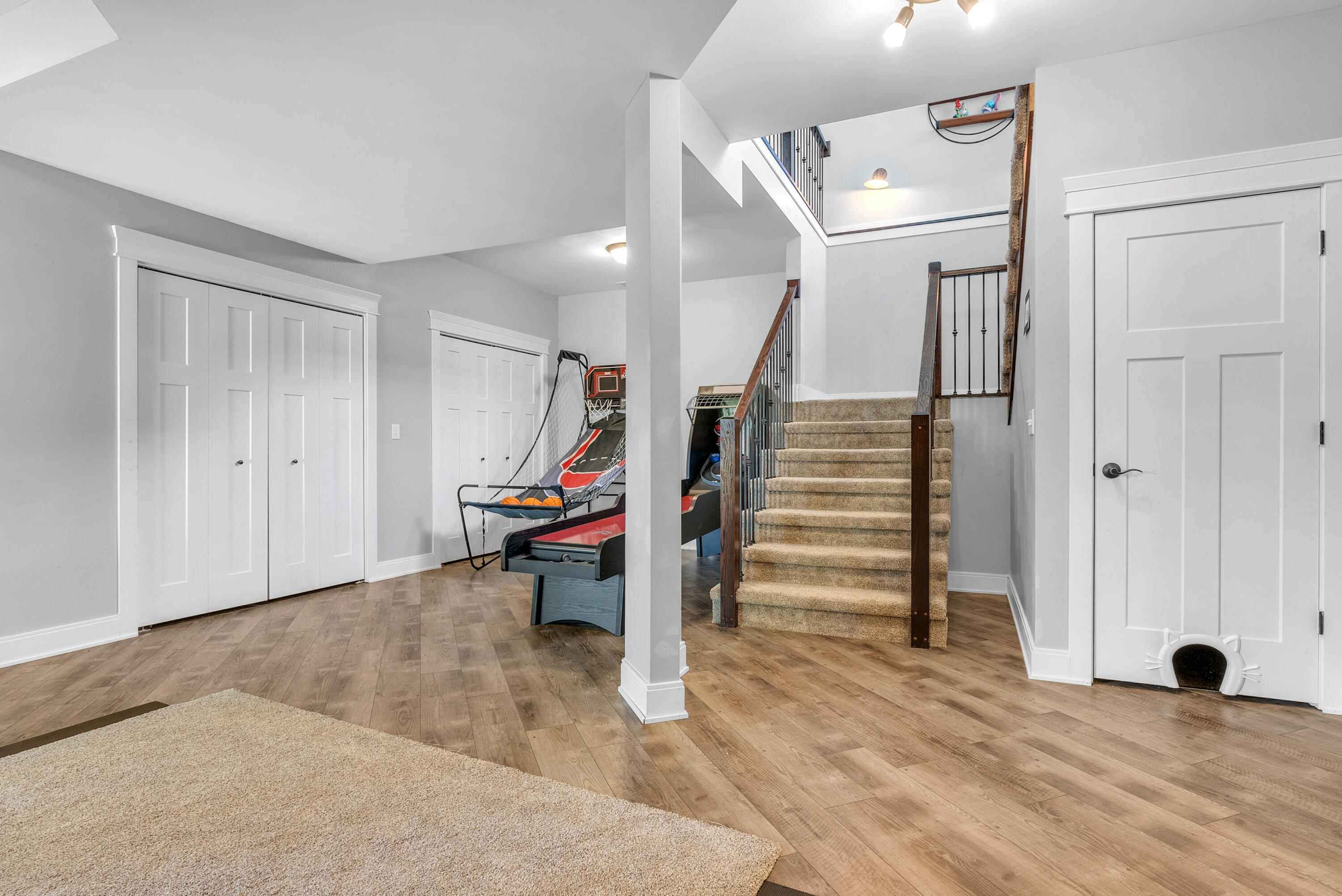10427 North 600th Street West Demotte, IN 46310 - Photo 19 of 26 a view of a livingroom with wooden floor and stairs