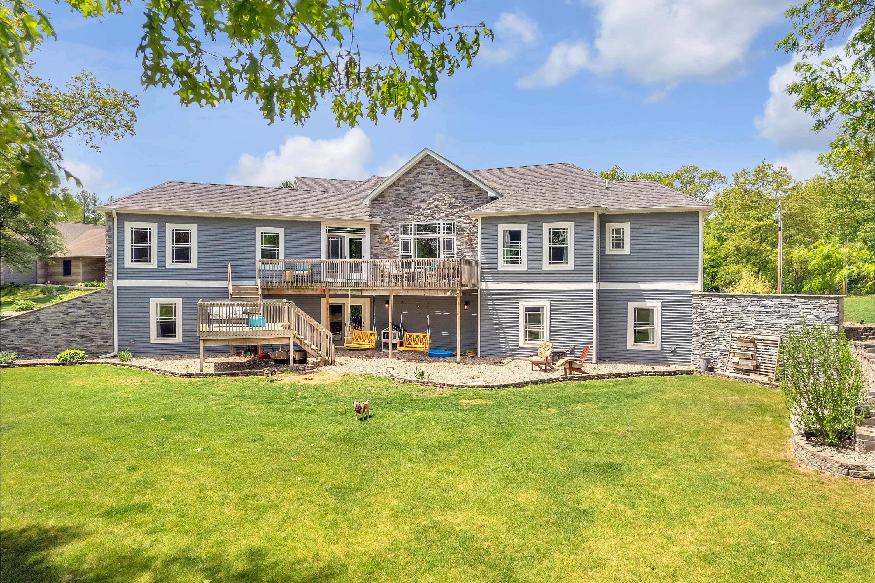10427 North 600th Street West Demotte, IN 46310 - Photo 20 of 26 a front view of a house with garden and trees