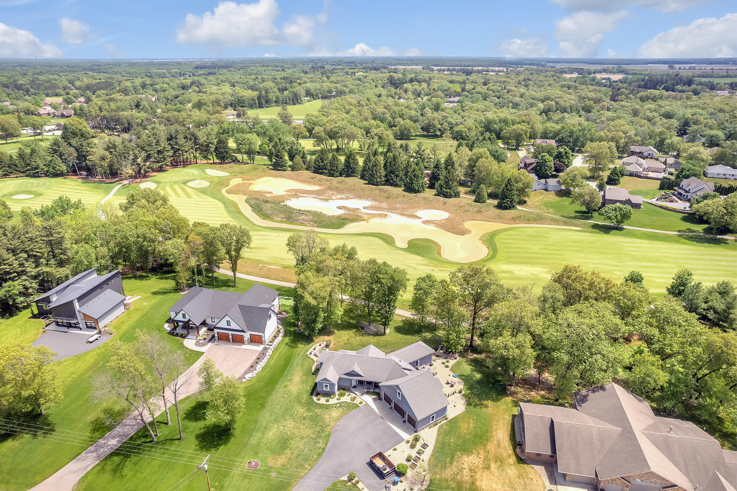 10427 North 600th Street West Demotte, IN 46310 - Photo 22 of 26 an aerial view of residential houses with outdoor space and trees