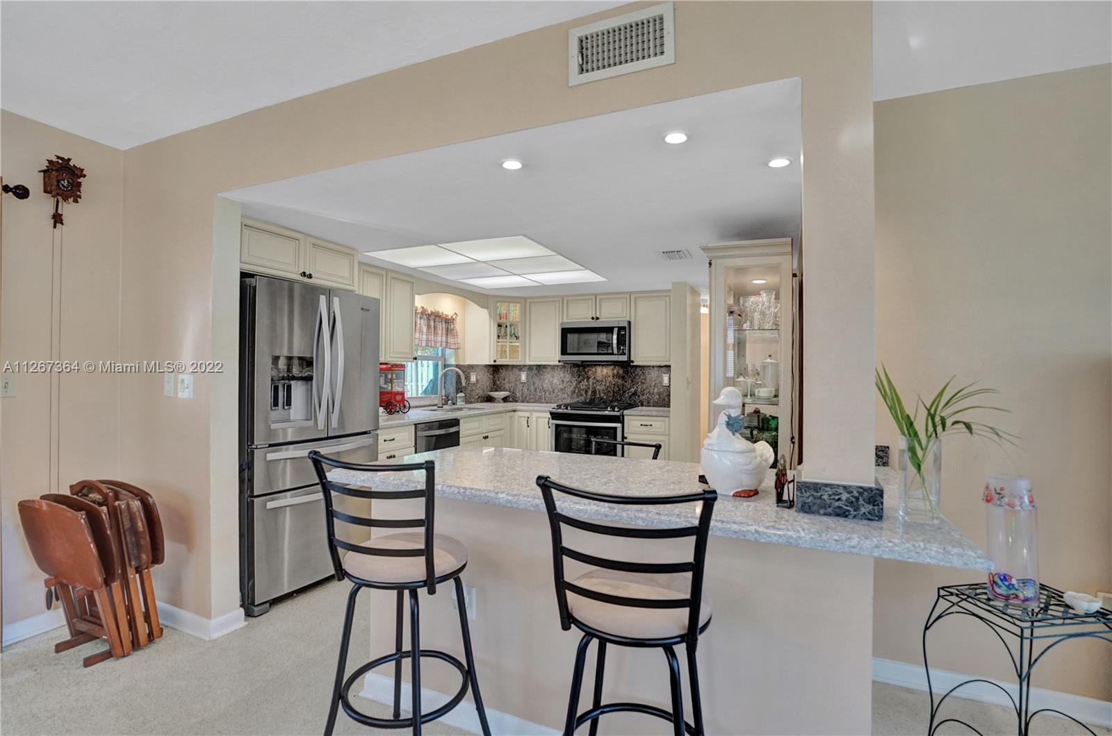 5440 Buchanan Street Hollywood, FL 33021 - Photo 12 of 34 a view of a dining room with furniture and a potted plant