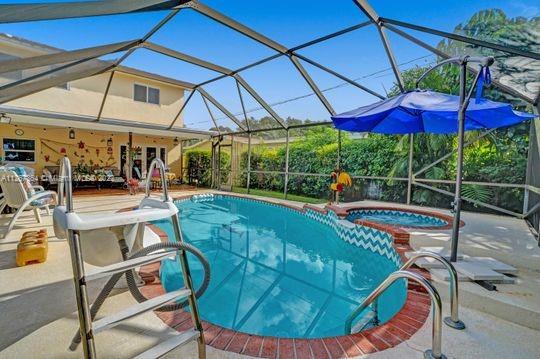 5440 Buchanan Street Hollywood, FL 33021 - Photo 15 of 34 a view of a swimming pool with a patio